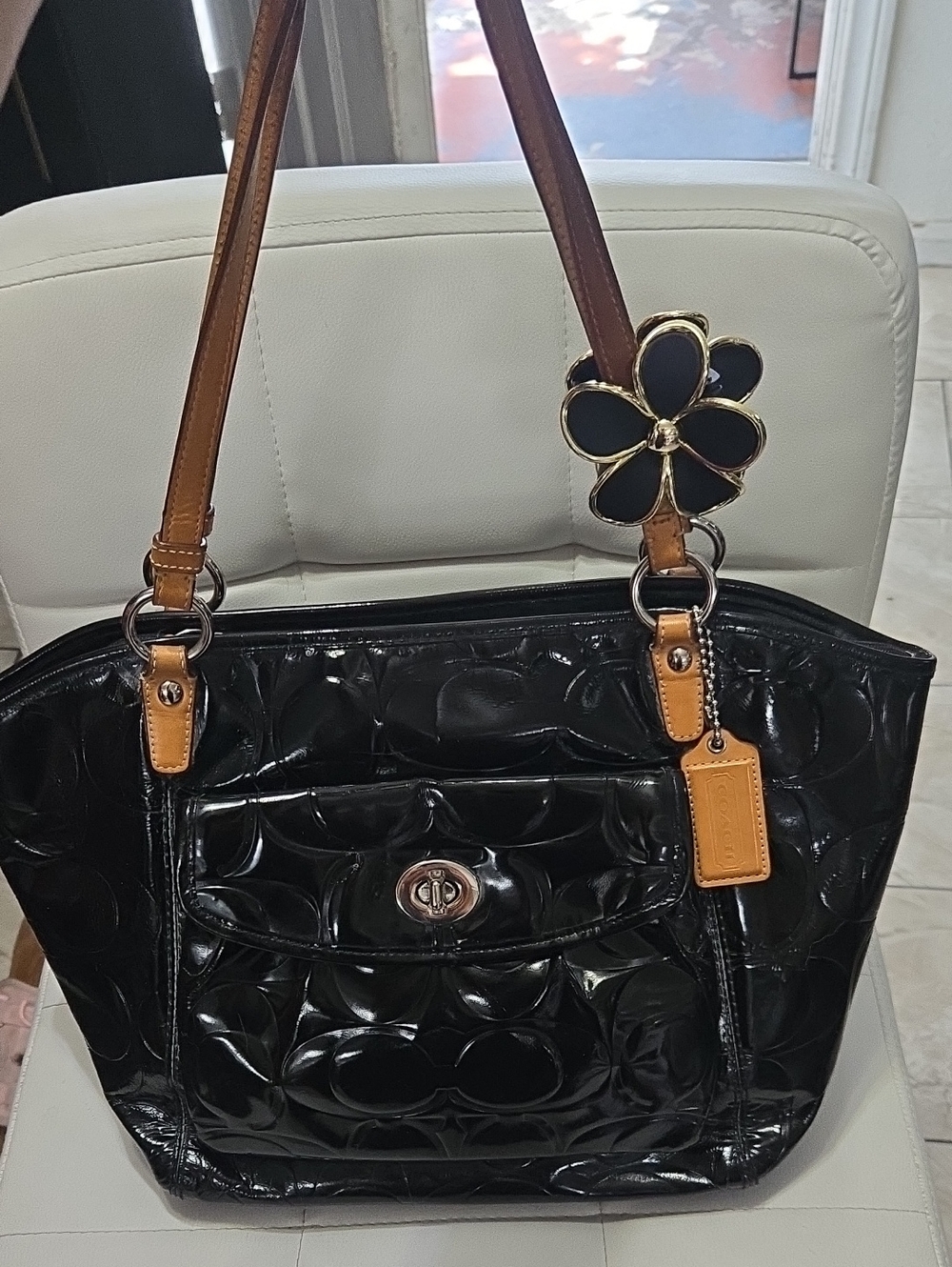 Coach Black Patent Tote with Tan Leather Handles and Floral Charm